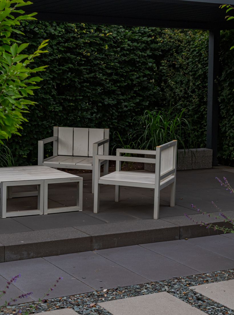 Minimalist patio with warm wooden furniture